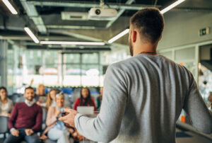 Lecture being given to group of adults