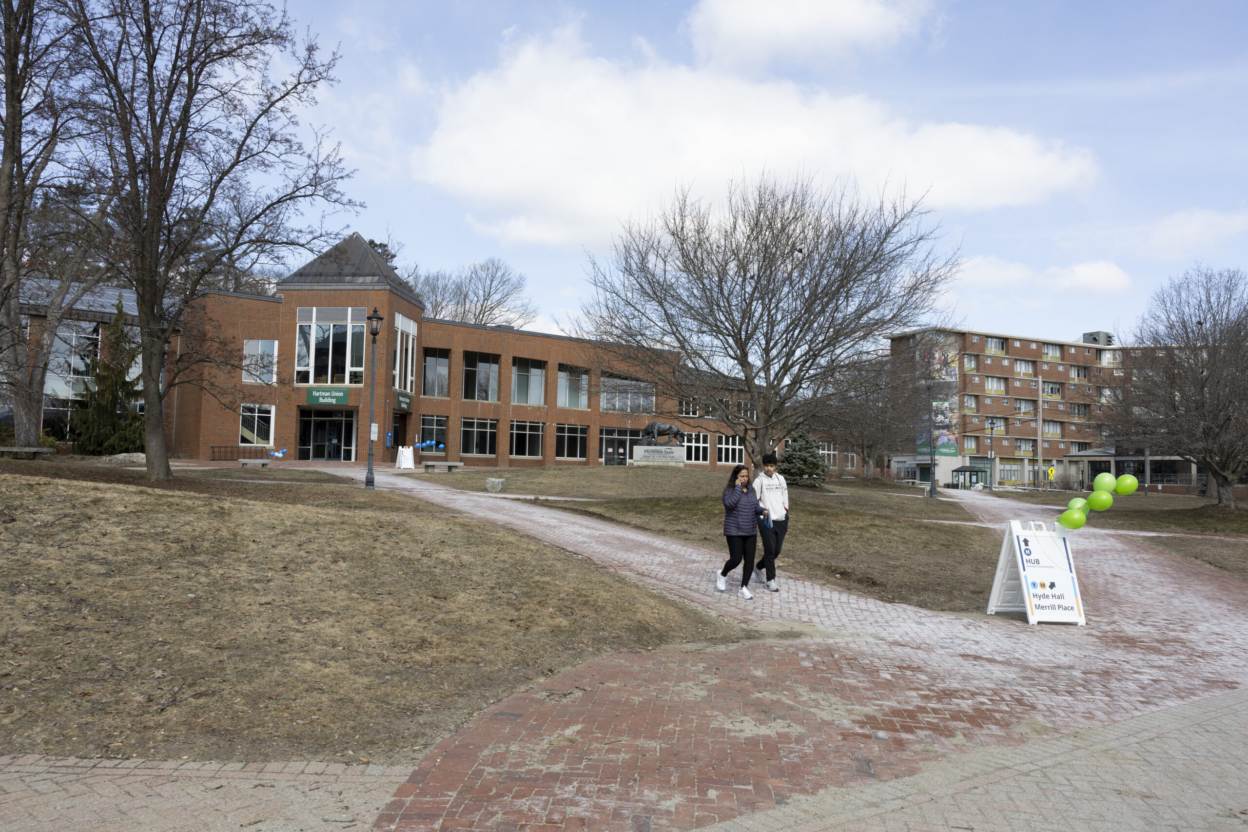 People walk between buildings at Plymouth State University