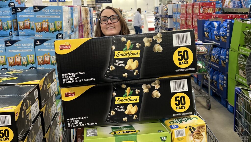 Granite Edvance team member Amy McLaughlin pushing a full grocery cart